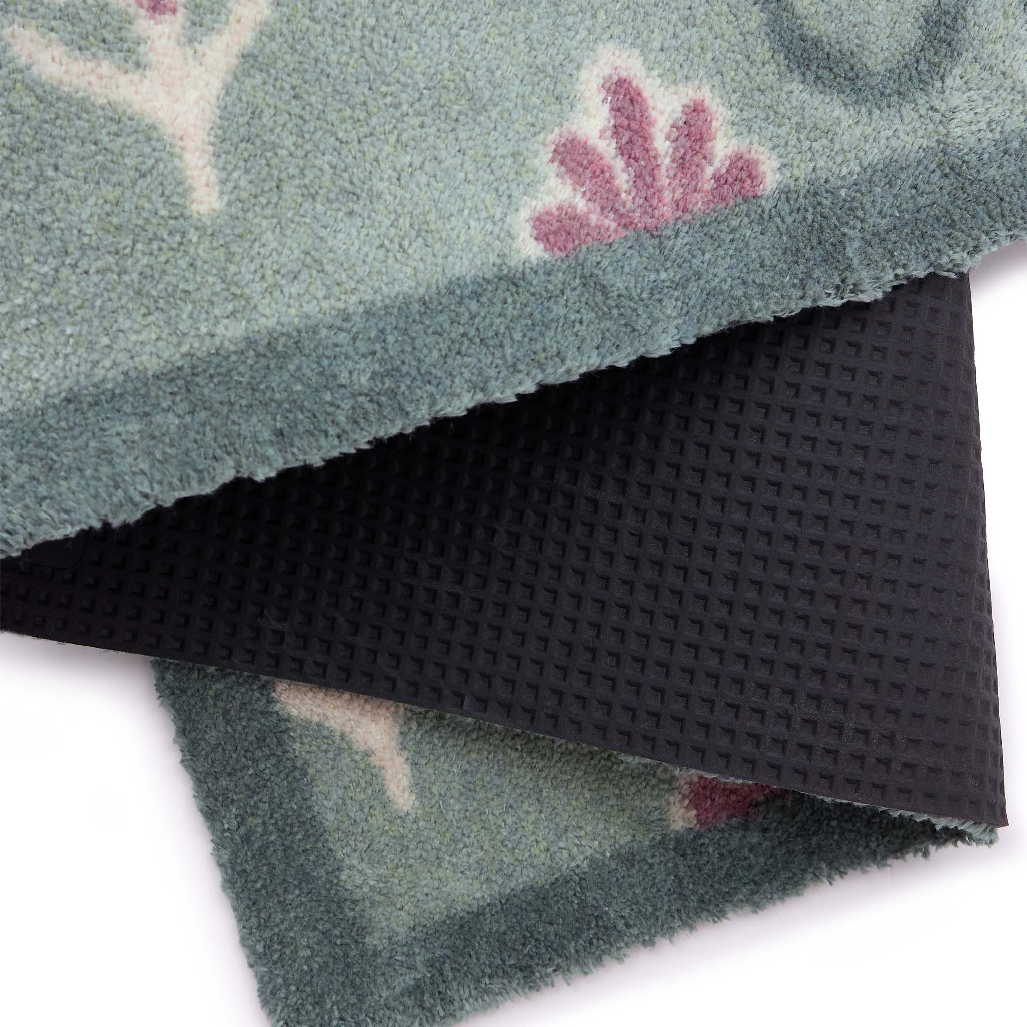 Disty Floral Green- Made from 100% recycled cotton featuring a woodblock pattern of purple flowers.